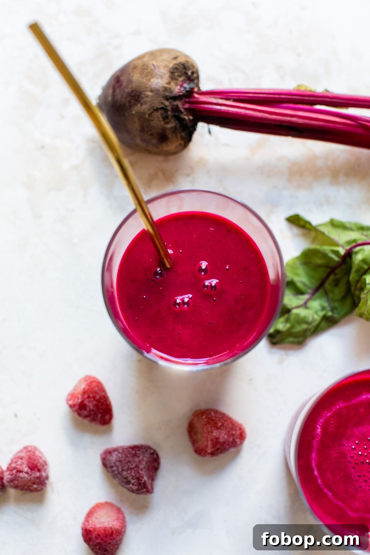 pink smoothie with a straw