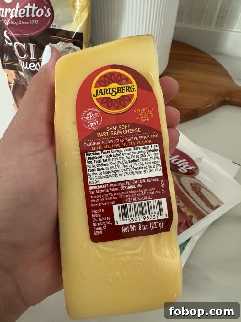 A wedge of Jarlsberg cheese
