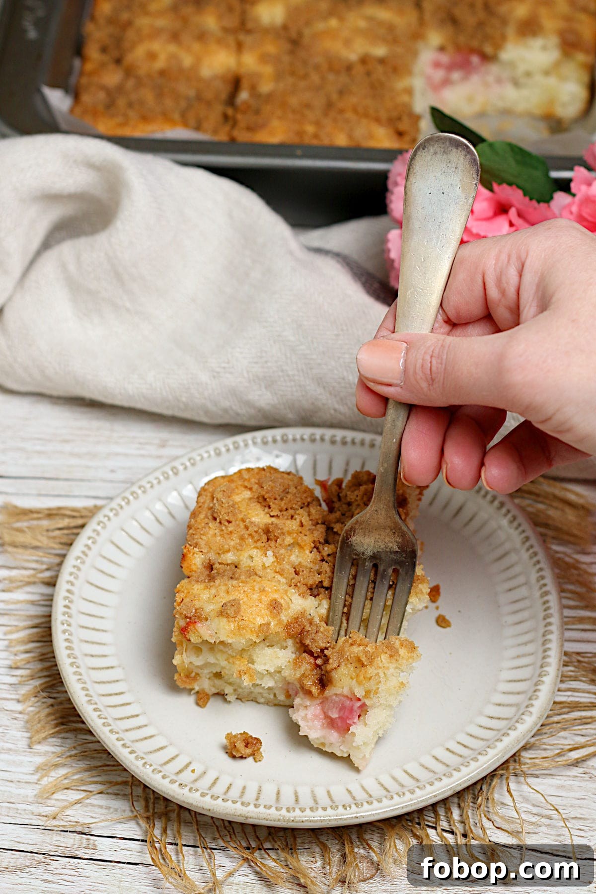 Moist Rhubarb Coffee Cake with Greek Yogurt 4 Greek Yogurt Rhubarb Coffee Cake on a small white plate.