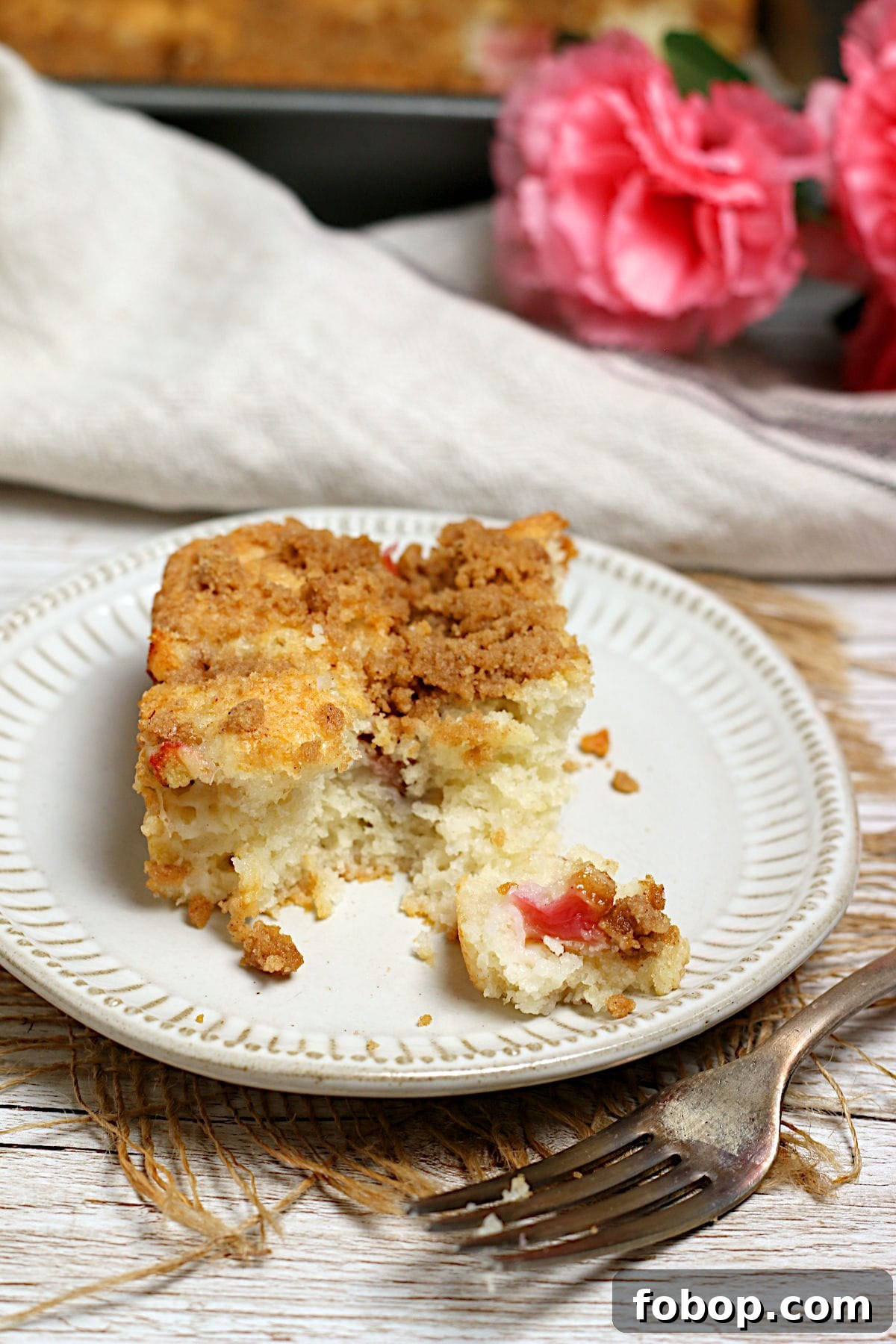 Moist Rhubarb Coffee Cake with Greek Yogurt 7 Greek Yogurt Rhubarb Coffee Cake on a small white plate.