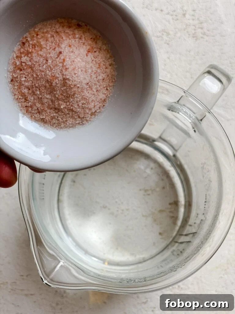 Handmade Flour Tortillas: Authentic Homemade Tortilla Recipe 6 process shot of adding salt to pitcher of water