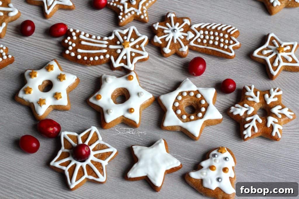 Gingerbread Wreath Recipe: Festive Holiday Cookie Centerpiece 5 Scattered gingerbread cookies decorated with royal icing, on wooden board.