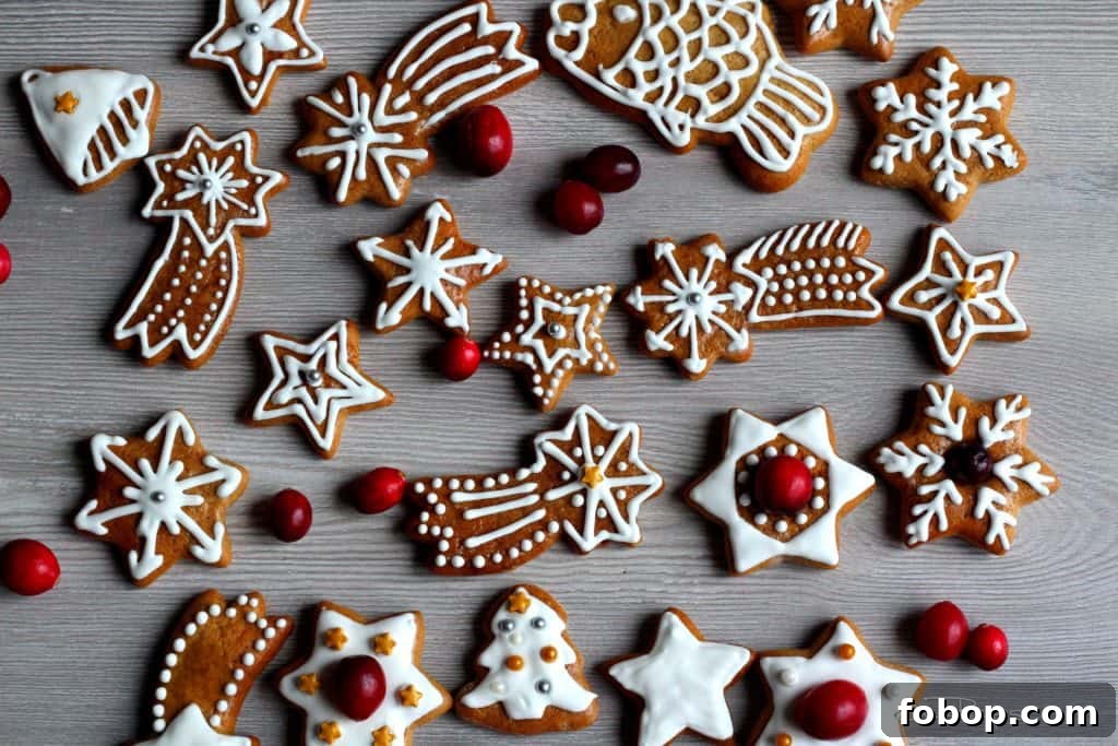 Gingerbread Wreath Recipe: Festive Holiday Cookie Centerpiece 6 Gingerbread decorated with icing, scattered on wooden board, giving warm and cozy Christmas mood.