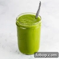 Authentic Green Enchilada Sauce Recipe for Flavorful Enchiladas 6 green enchilada sauce in a jar with a spoon