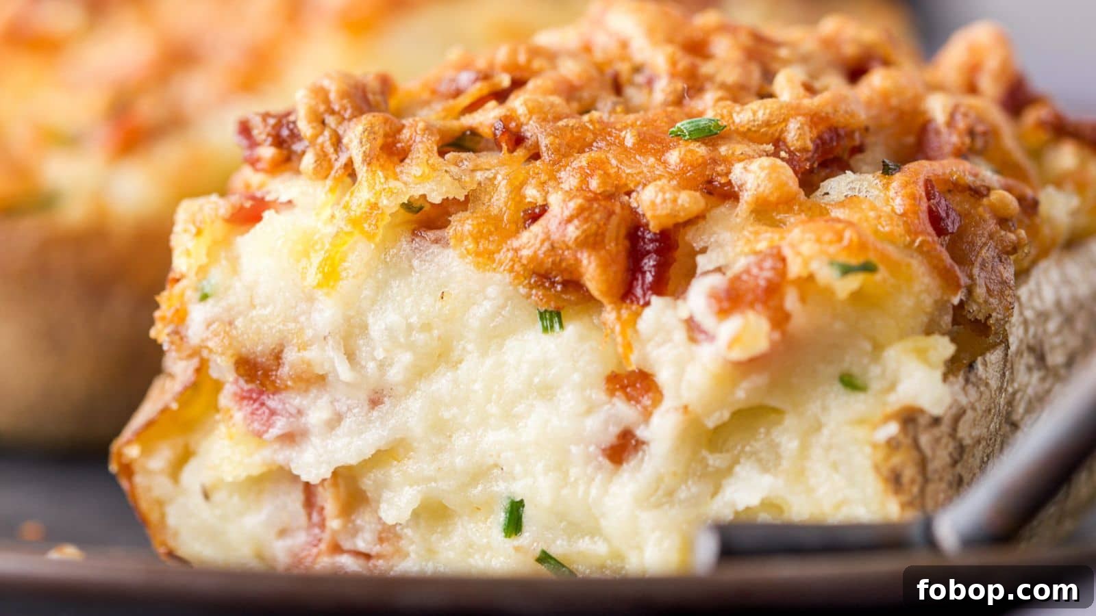 17 Flavor-Packed Side Dishes to Elevate Any Meal 2 close up of a creamy potato with cheese melted on top