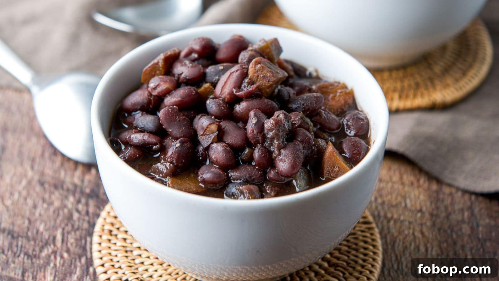 17 Flavor-Packed Side Dishes to Elevate Any Meal 16 a small white bowl with black beans in it
