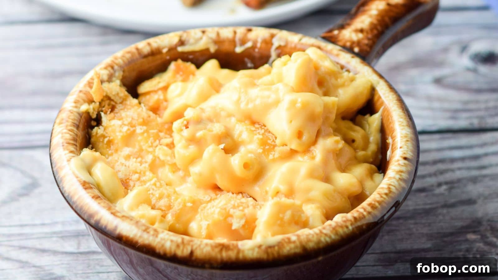 17 Flavor-Packed Side Dishes to Elevate Any Meal 18 A crock filled with mac and cheese with cracker crumbs on top