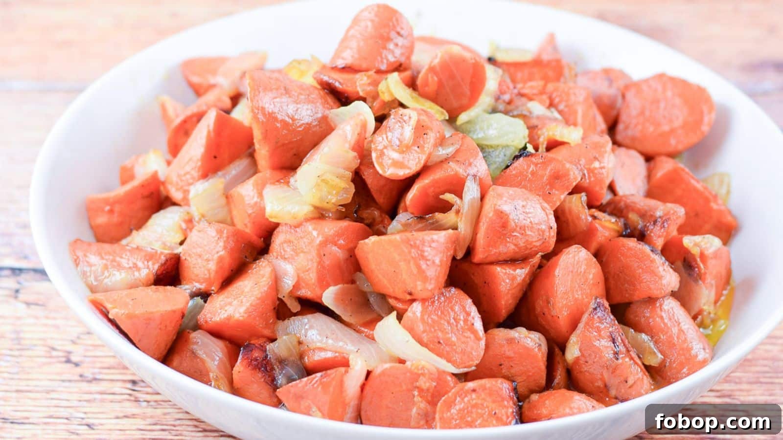 17 Flavor-Packed Side Dishes to Elevate Any Meal 4 a white bowl with carrots and onions in it