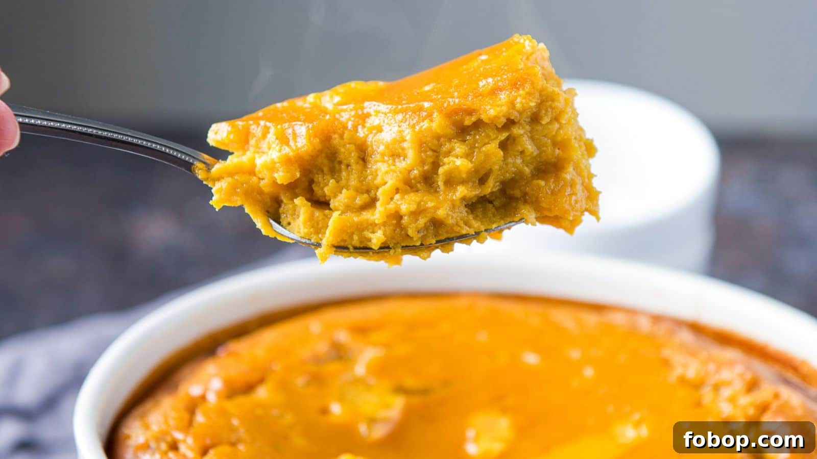 17 Flavor-Packed Side Dishes to Elevate Any Meal 7 A fork with some squash on it held over the bowl of it