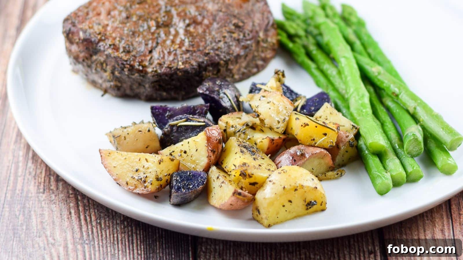 17 Flavor-Packed Side Dishes to Elevate Any Meal 9 a white plate with potatoes, asparagus, and steak