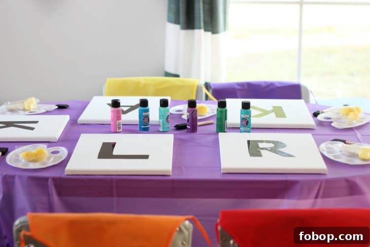 Kids' Painting Party Ideas for a Creative Birthday Celebration 5 Table set up with paints, palettes, and brushes for a kids’ painting party