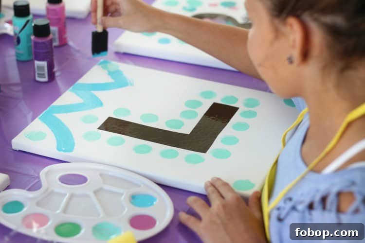 Kids' Painting Party Ideas for a Creative Birthday Celebration 8 Kids’ finished paintings drying on a table