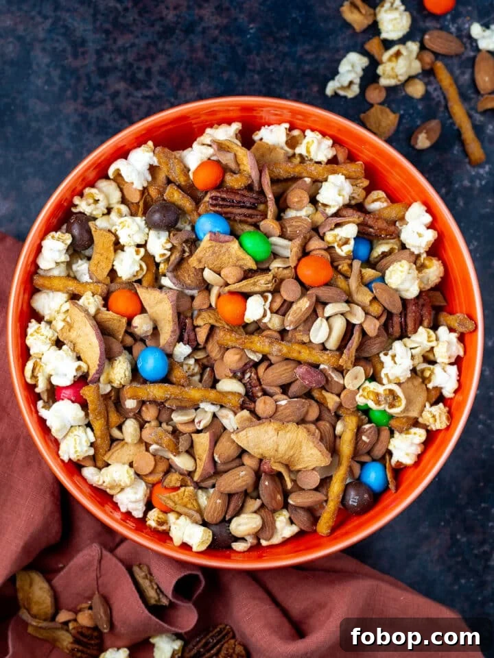 large orange bowl with caramel apple trail mix
