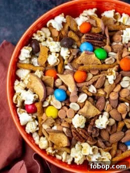 large orange bowl with caramel apple trail mix