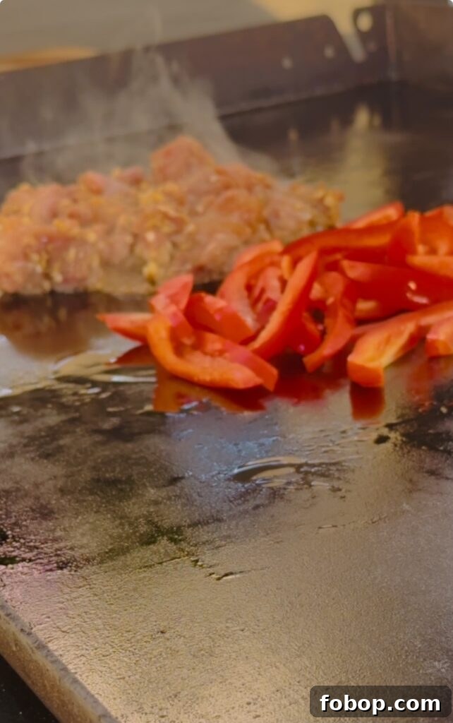 Low-Carb Peanut Chicken Noodles for Blackstone Grill 4 cooking the chicken and peppers