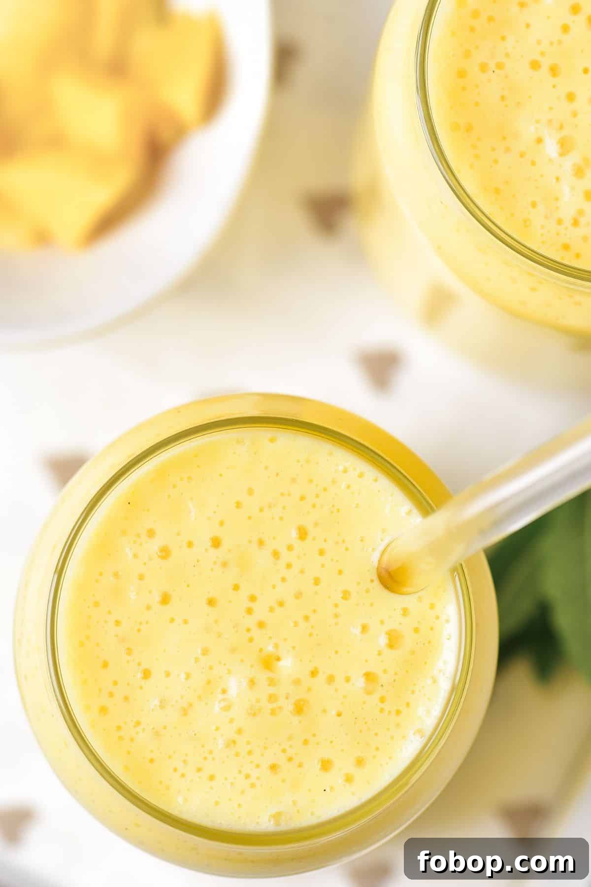 Top down view of creamy mango shake.