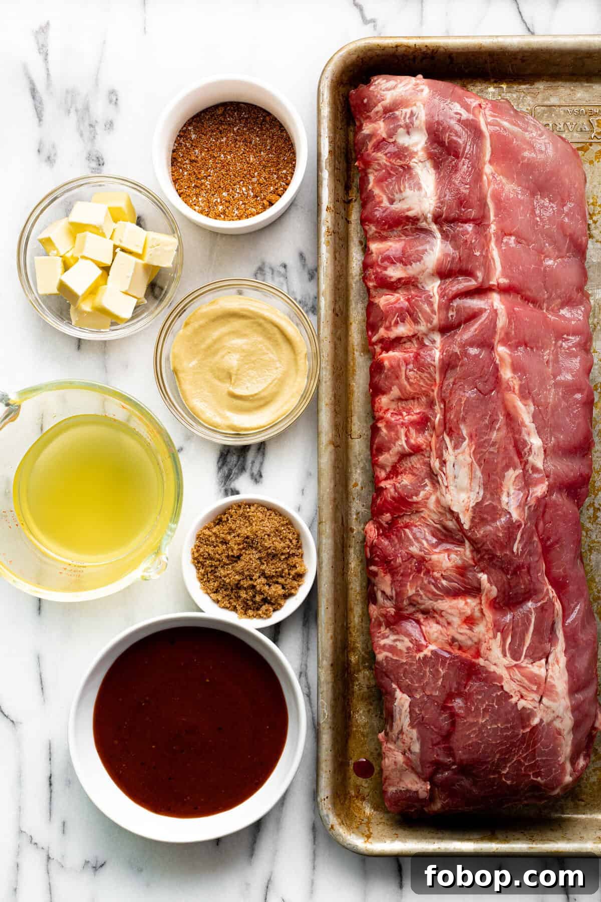Smoked Baby Back Ribs: Tender, Flavorful Recipe for Beginners 3 White marble countertop with bowls of ingredients to make ribs.