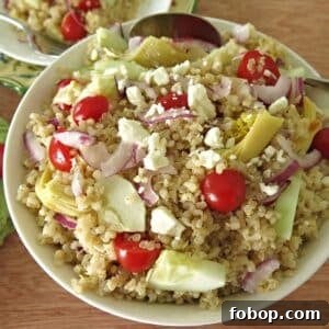 Greek Quinoa Salad with Red Wine Vinaigrette Recipe 6 Greek quinoa salad with red wine vinaigrette in a serving bowl.