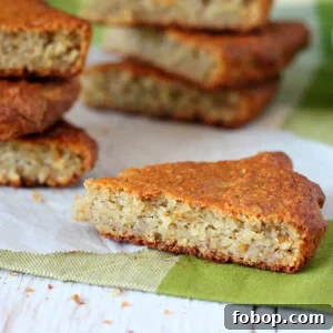 Triangles of banana quick bread on a white wooden background