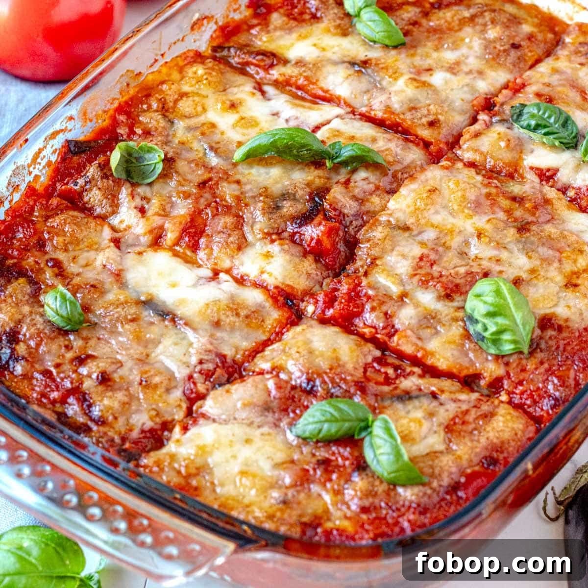 30 Delicious Eggplant Recipes for Every Meal 3 Parmigiana with eggplant and fresh basil leaves