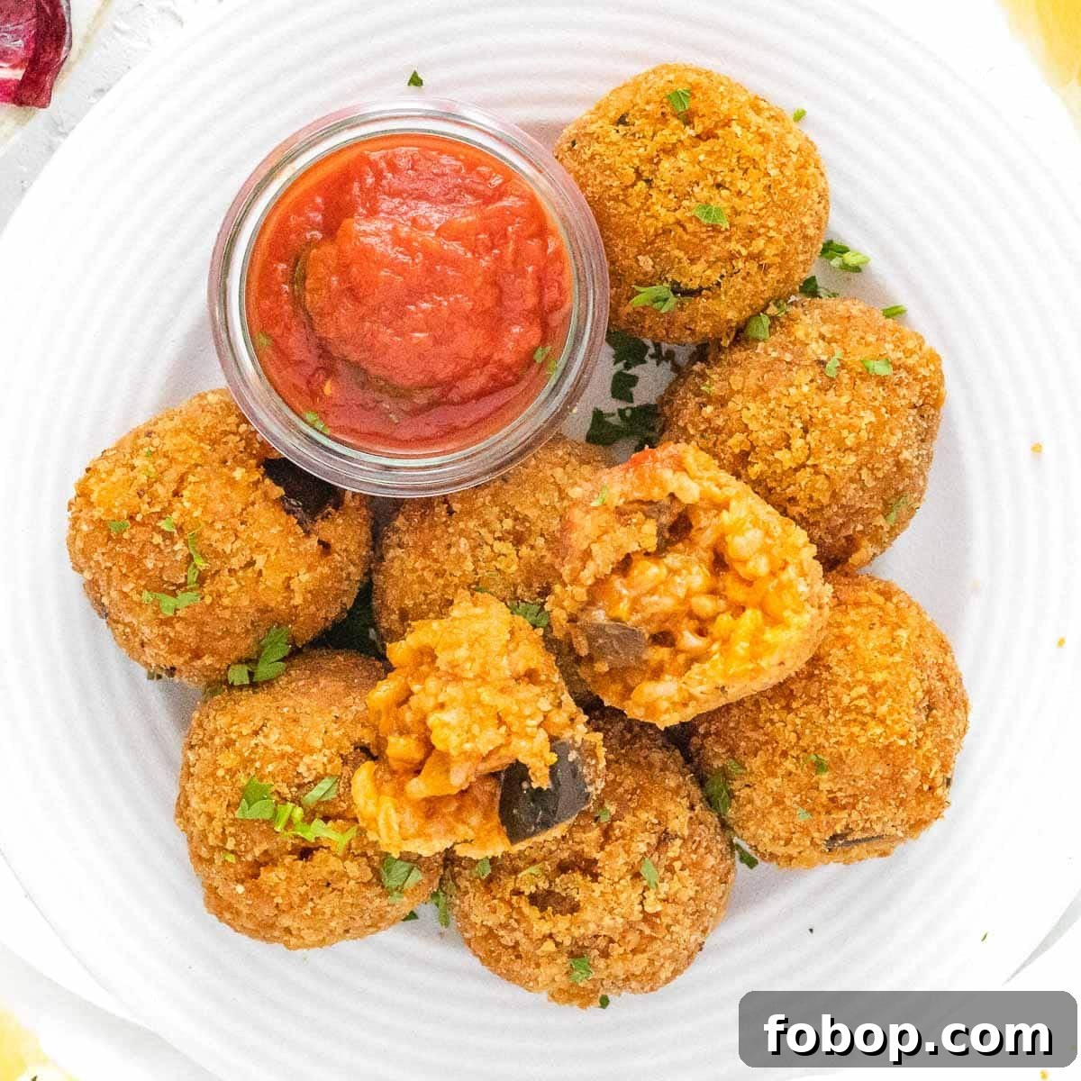 30 Delicious Eggplant Recipes for Every Meal 7 Italian Rice Balls with marinara sauce