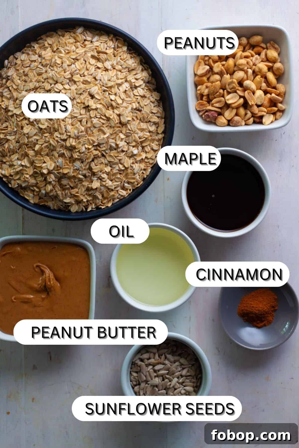 Crunchy Peanut Butter Granola Recipe for Homemade Snacks 3 Peanut butter granola ingredients on a white table.