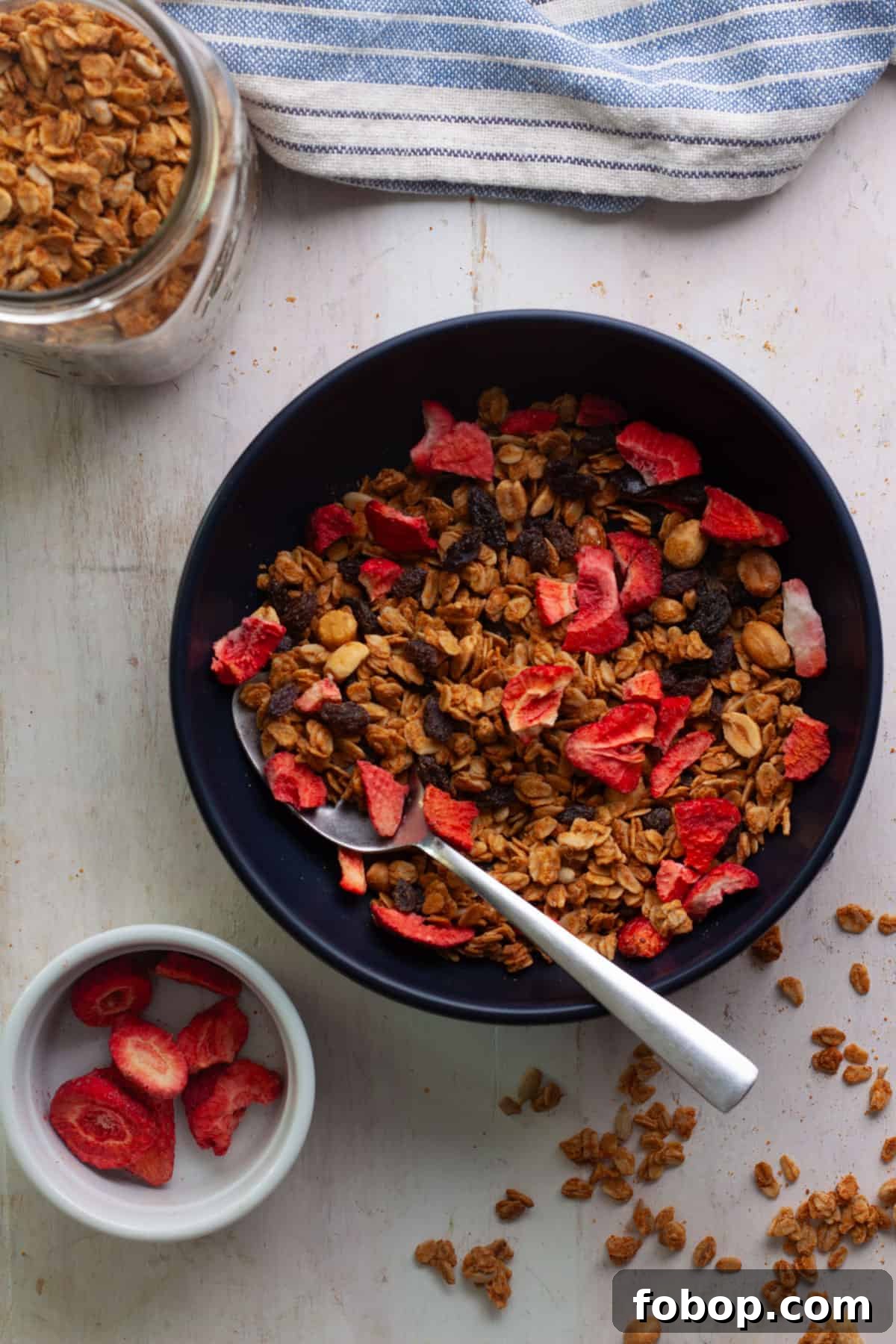 Crunchy Peanut Butter Granola Recipe for Homemade Snacks 8 A bowl of peanut butter granola with strawberries.