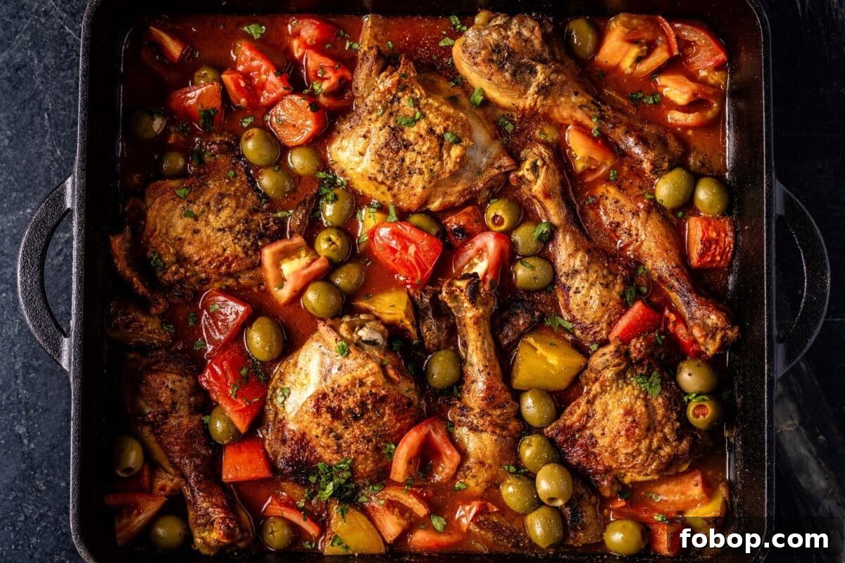 A serving platter filled with pollo guisado.