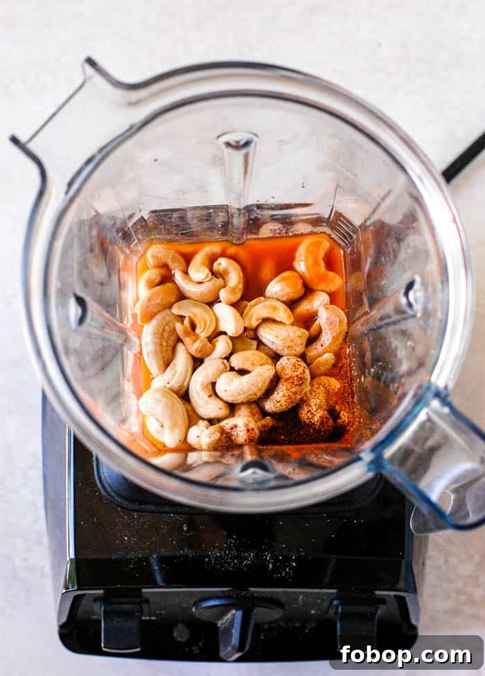Creamy Vegan Buffalo Sauce Recipe for Wings & Dips 3 cashews, buffalo sauce, chili powder in a vitamix