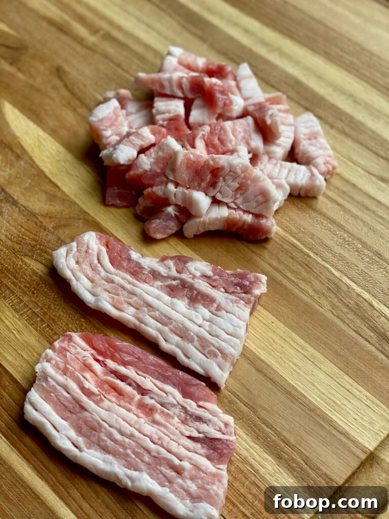 Jajangmyeon: Authentic Korean Black Bean Noodle Recipe 3 Pork belly strips scored and cut into thin pieces.