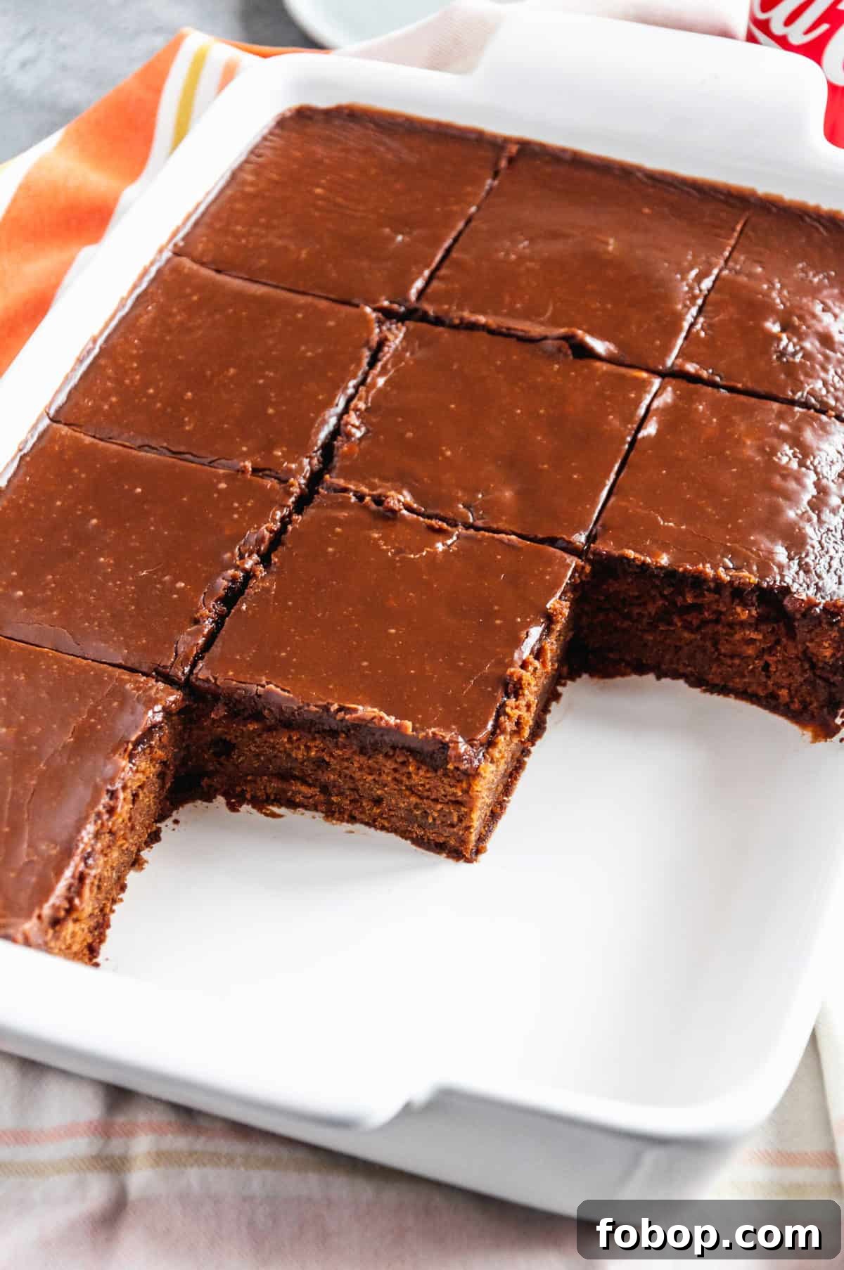 Moist Chocolate Coca-Cola Cake Recipe for Every Occasion 2 Coca-Cola Cake sliced into squares served in a baking dish