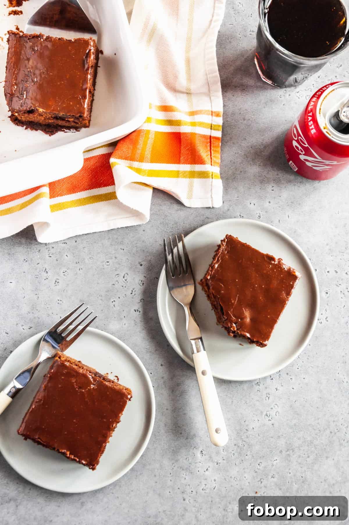 Moist Chocolate Coca-Cola Cake Recipe for Every Occasion 3 two serving of coca cola cake on a plate with forks