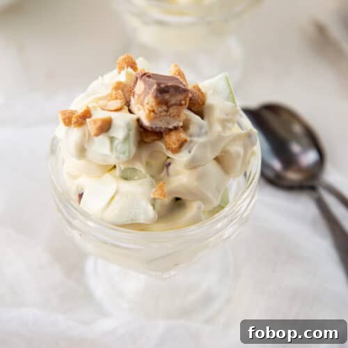 snickers salad in a glass parfait cup.
