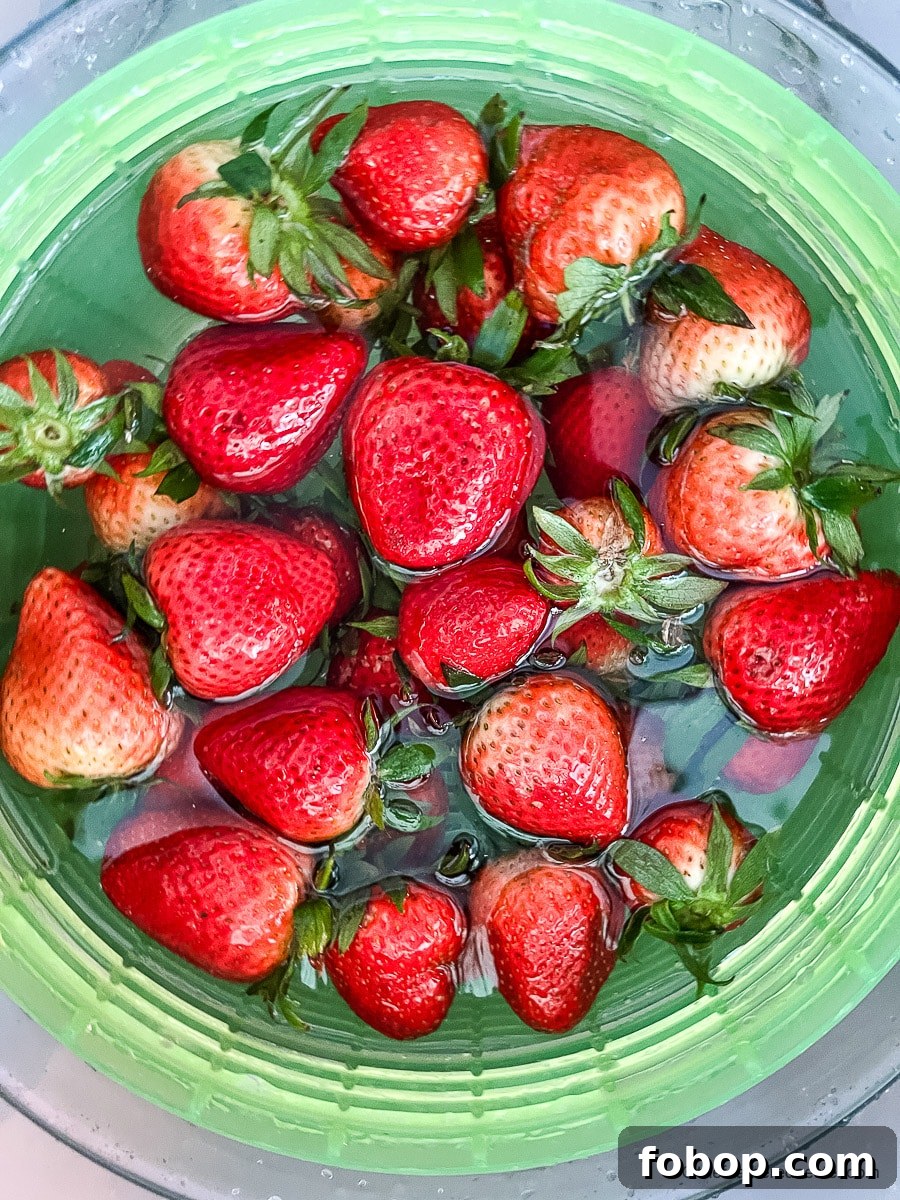 Fresh Blueberry and Strawberry Summer Salad Recipe 5 Rinsing fresh berries in water.