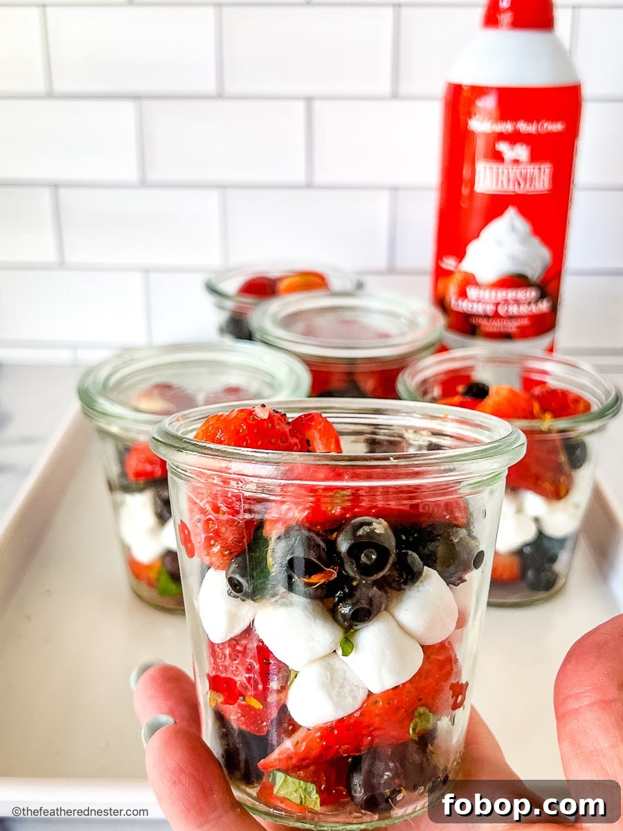 Fresh Blueberry and Strawberry Summer Salad Recipe 8 4th of July strawberry blueberry salad in small jars.