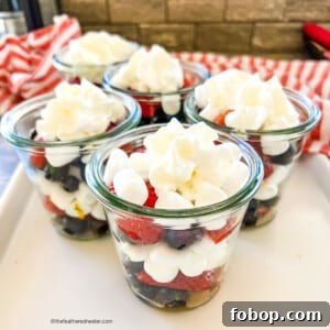 Fresh Blueberry and Strawberry Summer Salad Recipe 10 Small cups filled with mini marshmallows and red and blue berries.