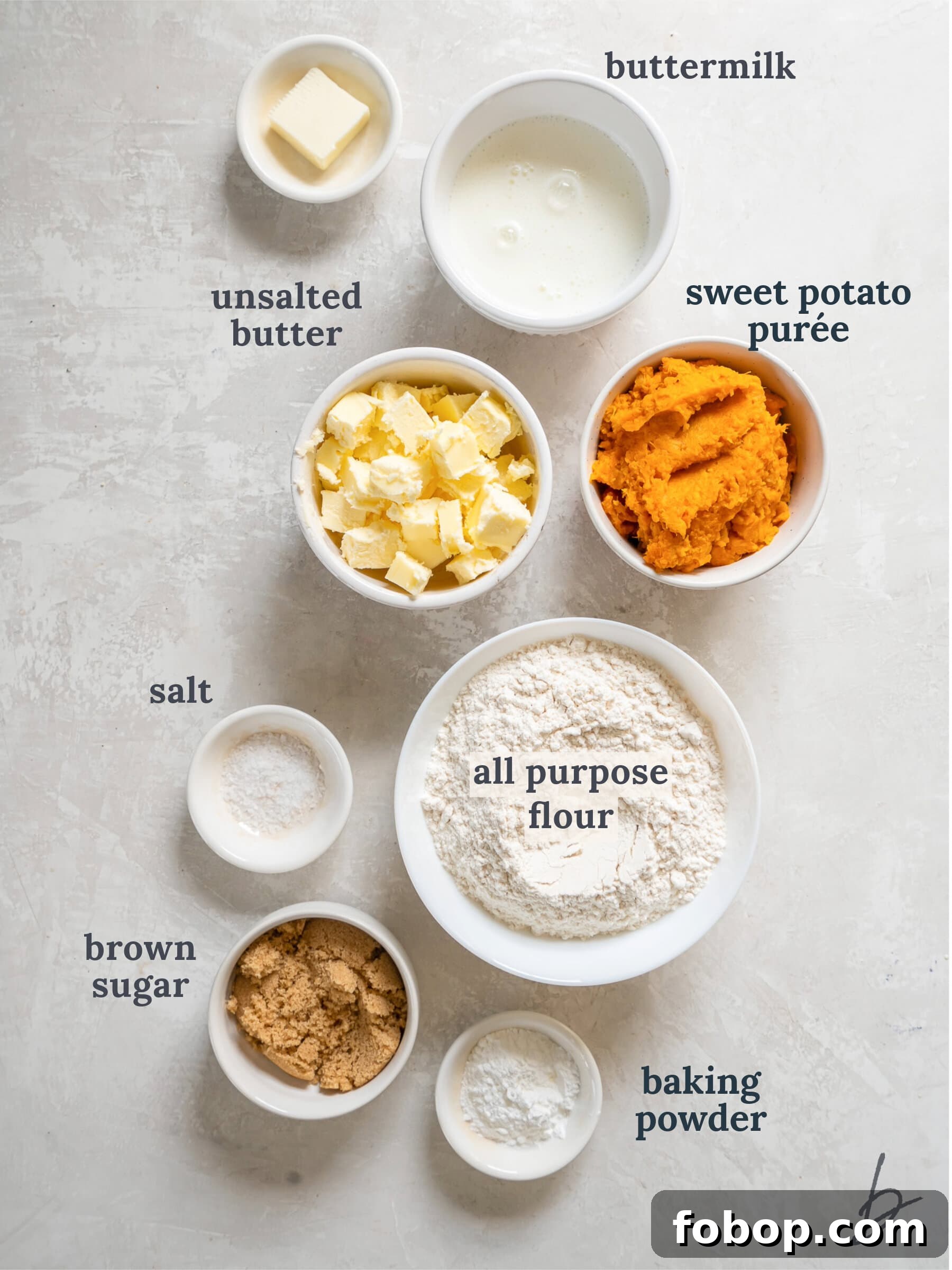 bowls of ingredients to make sweet potato biscuits.