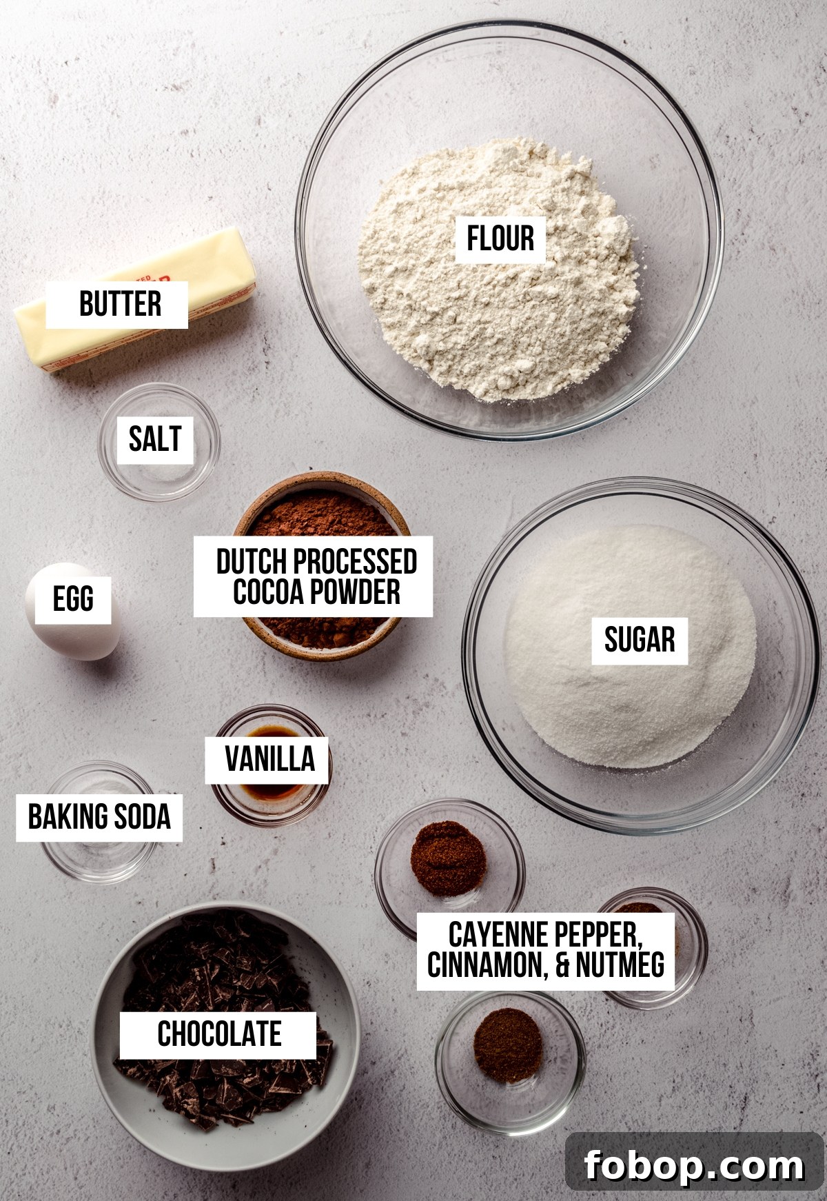 Arial photo of ingredients to make chocolate cayenne cookies with text overlay labeling each ingredient.