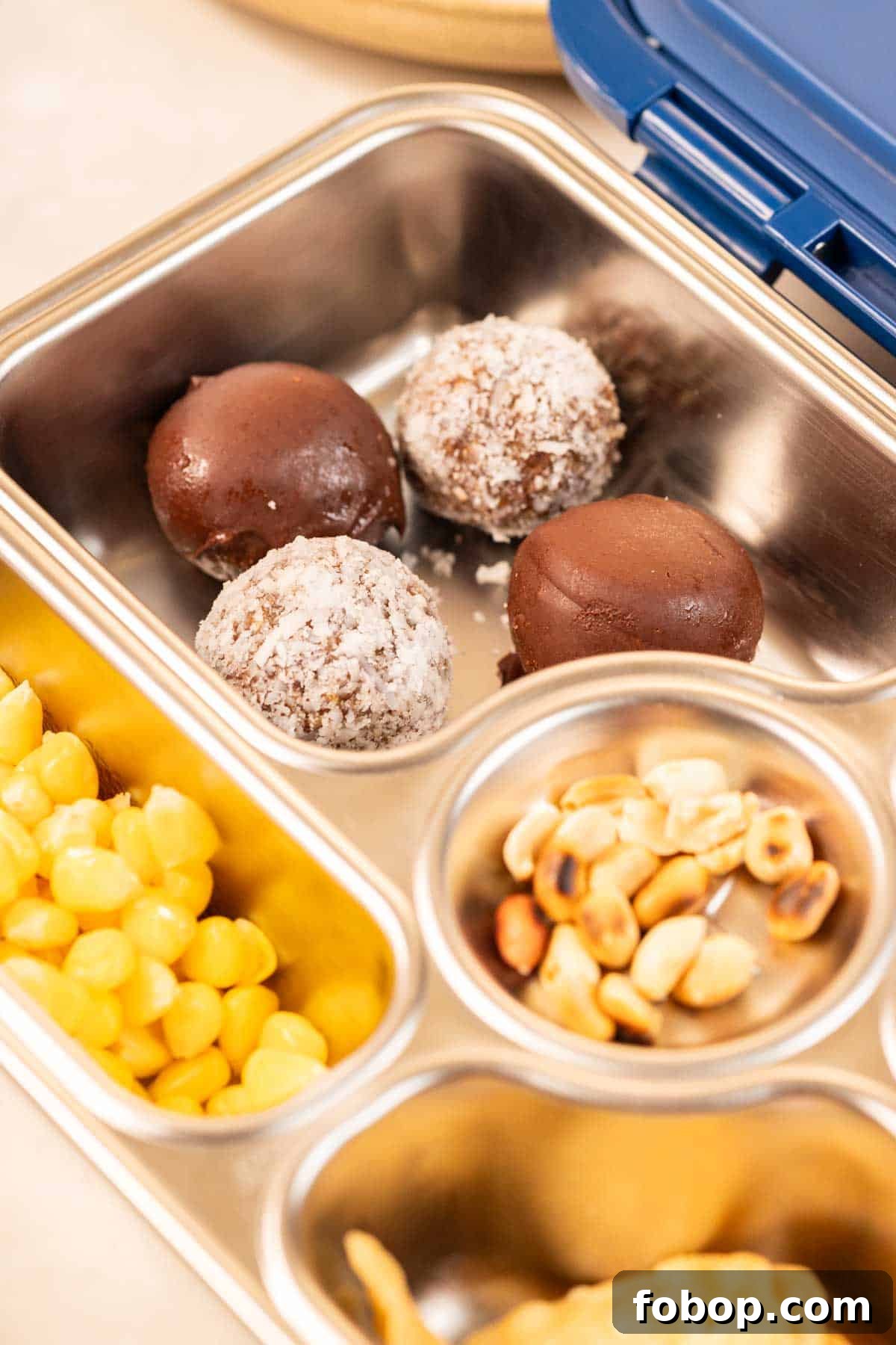 peanut butter oats energy balls with dates in a tiffin box