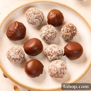 peanut butter oats energy balls with dates served on a white plate