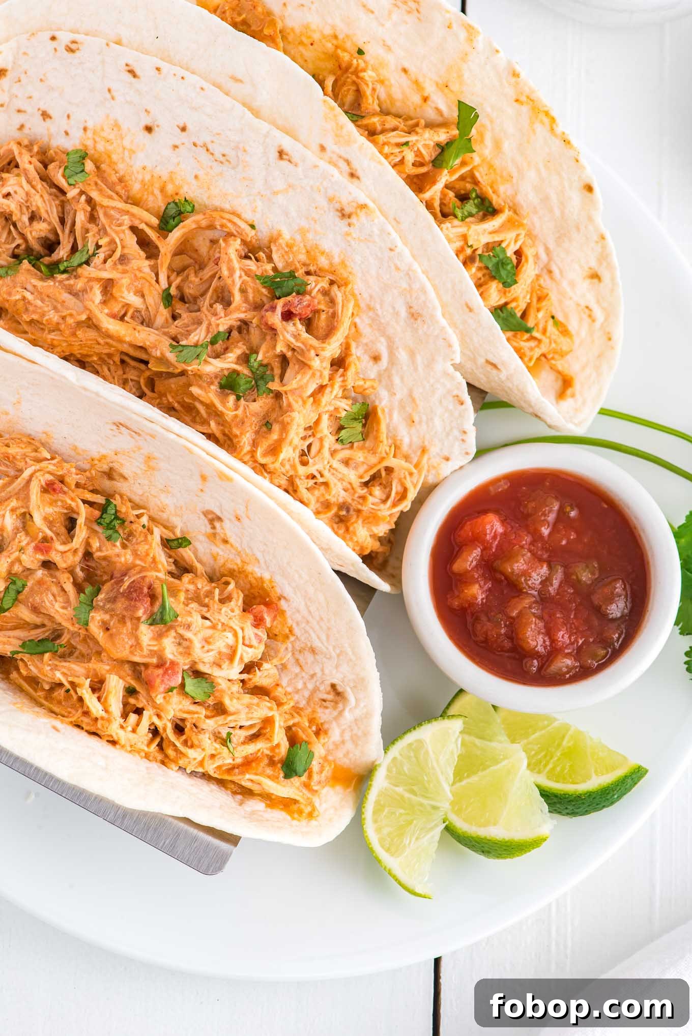 Crockpot salsa chicken in  tortillas. 