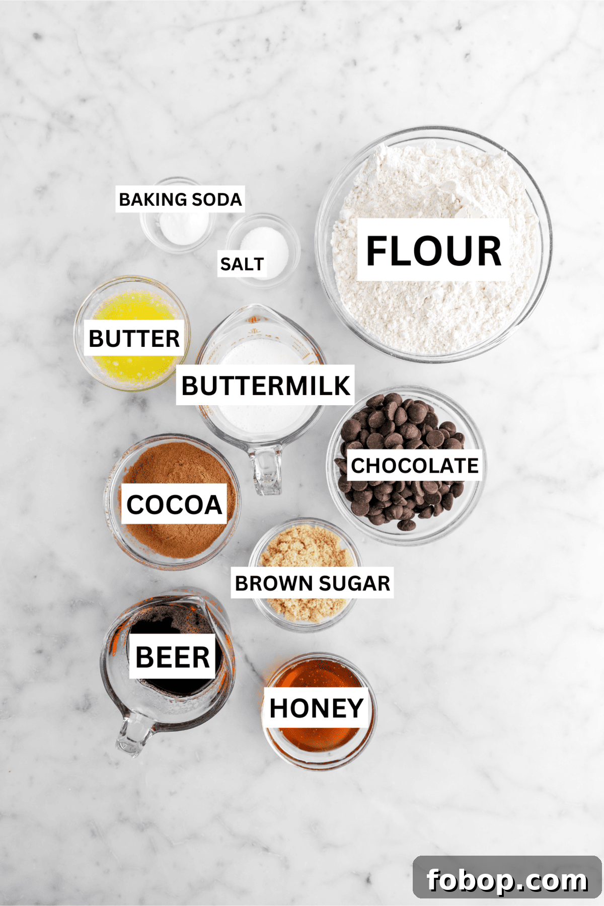 Double Chocolate Irish Stout Soda Bread Recipe for Rich Treat 4 ingredients for chocolate soda bread on marble surface with text over each ingredient.