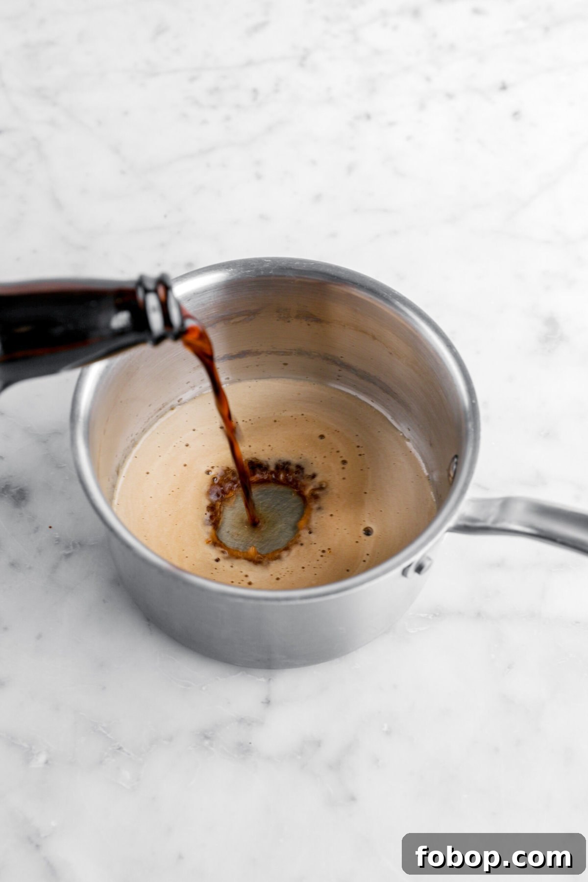 Double Chocolate Irish Stout Soda Bread Recipe for Rich Treat 5 beer being poured into small pot.