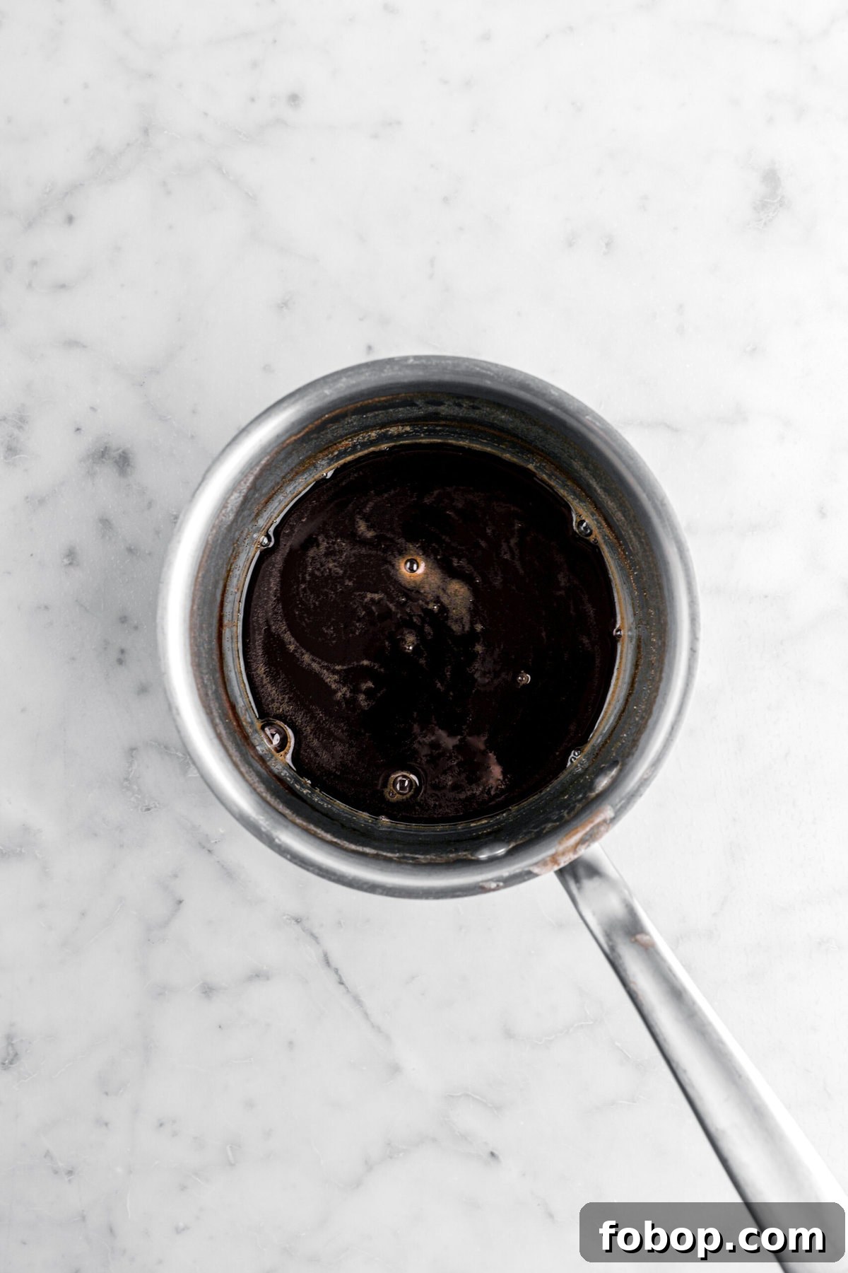 Double Chocolate Irish Stout Soda Bread Recipe for Rich Treat 6 reduced beer in small pot.