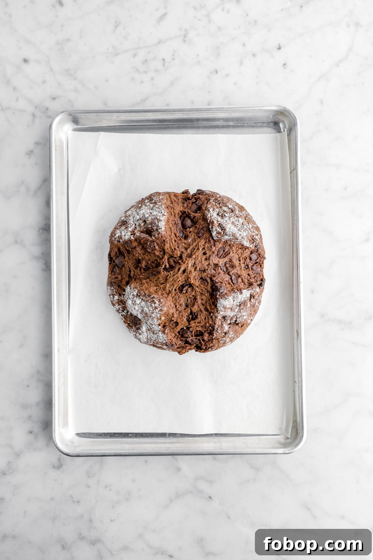 Double Chocolate Irish Stout Soda Bread Recipe for Rich Treat 10 baked chocolate soda bread on lined sheet pan.