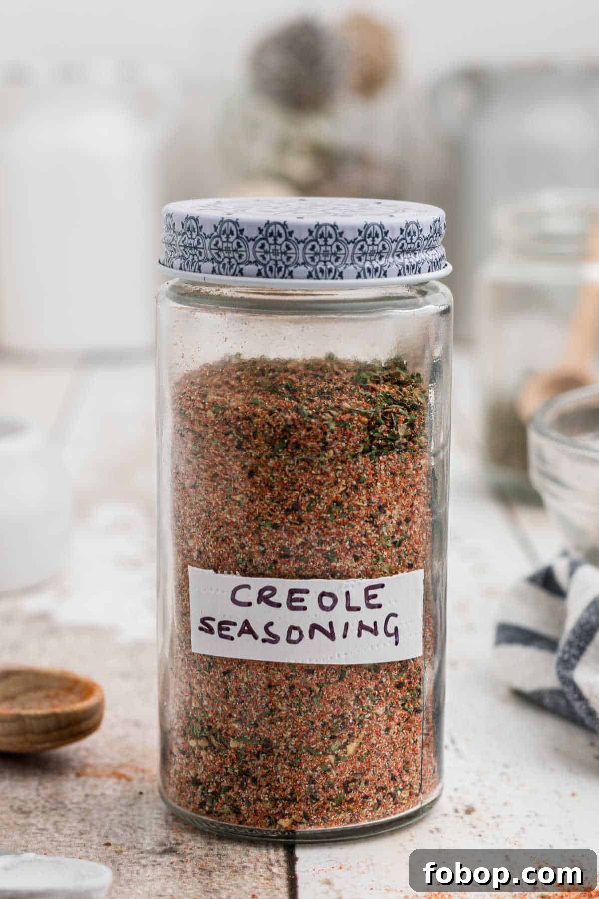Authentic Homemade Creole Seasoning Recipe for Bold Flavor 2 a jar of seasoning with a label on the front that reads Creole Seasoning