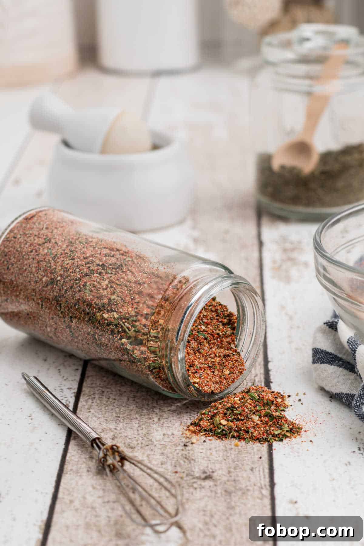 Authentic Homemade Creole Seasoning Recipe for Bold Flavor 10 a jar full of creole seasoning that is knocked over