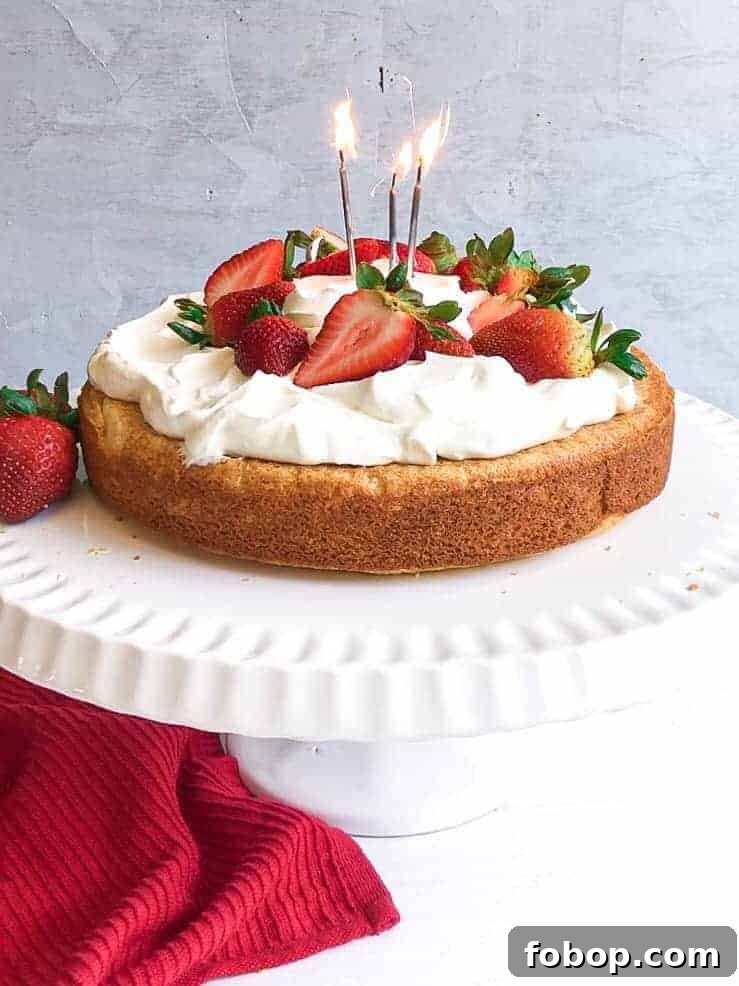 Gluten-Free Lemon Vanilla Cake Recipe for Moist, Zesty Slices 2 A gluten free lemon vanilla cake with strawberries and cream