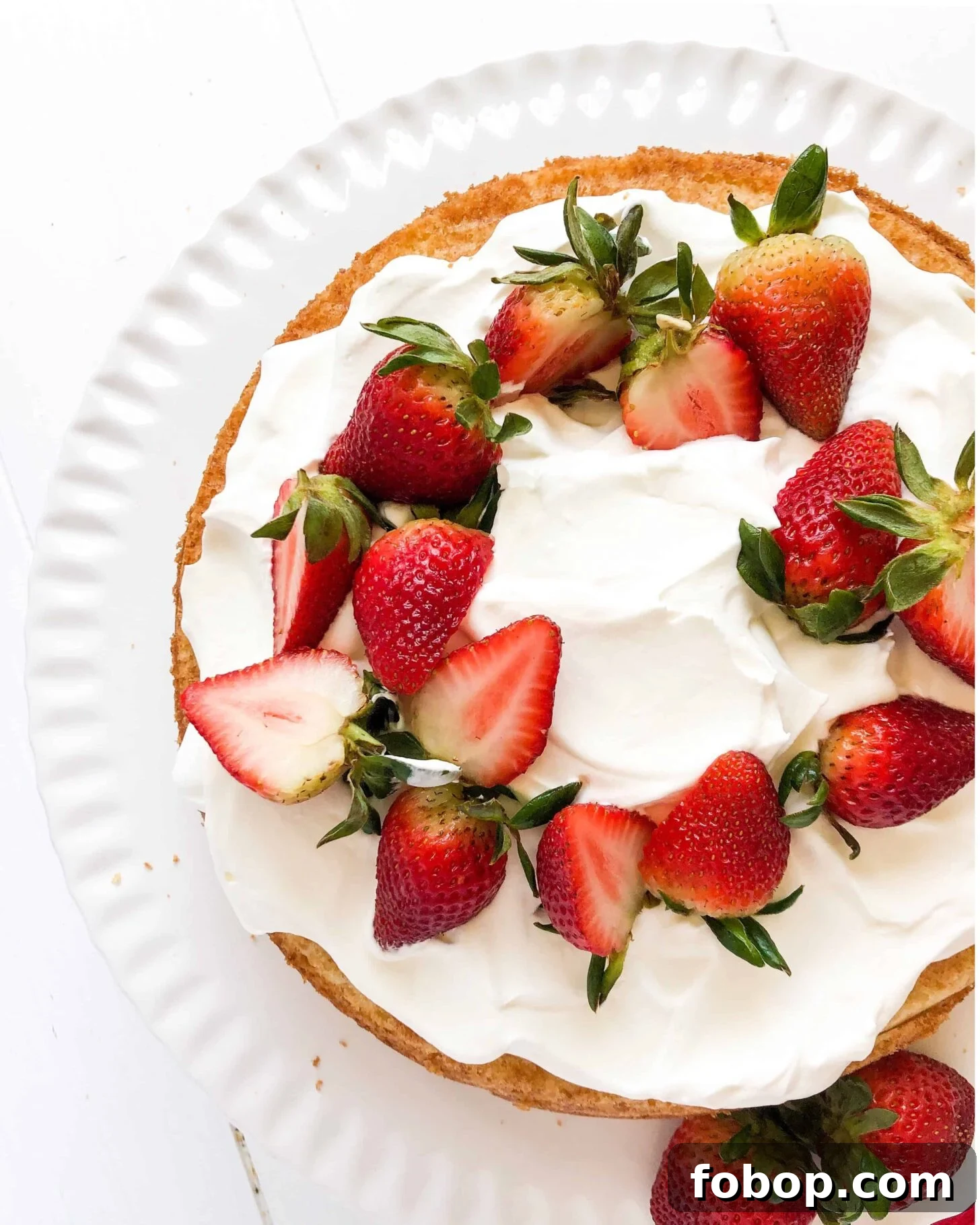 Gluten-Free Lemon Vanilla Cake Recipe for Moist, Zesty Slices 5 A gluten free lemon vanilla cake with strawberries and cream