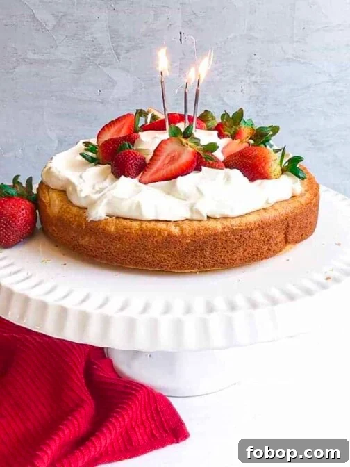 A gluten free lemon vanilla cake with strawberries and cream